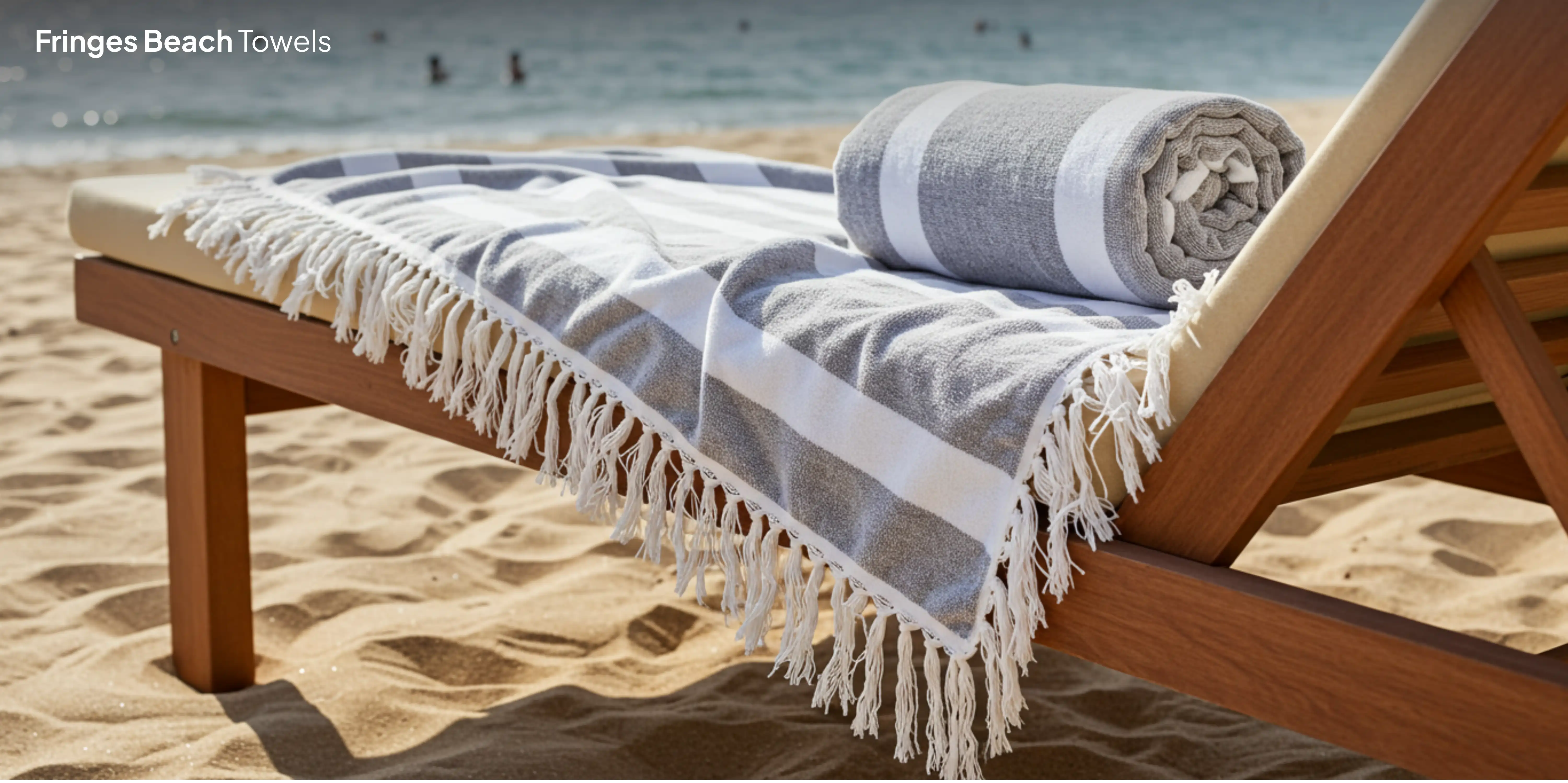 Gray striped beach towel on lounge chair